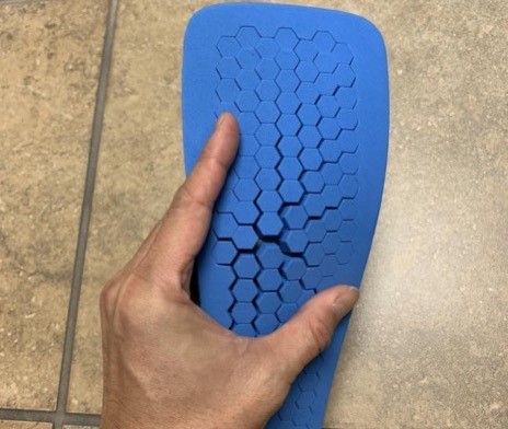 Post-operative shoe, insole with pre-cut plugs